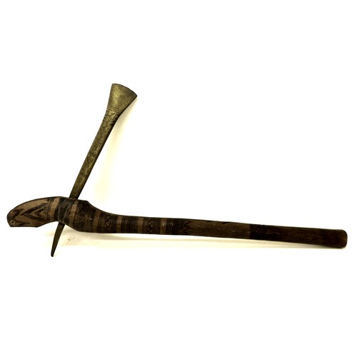 289 - Ethnographic / Tribal interest: a brass bladed African adze, the hardwood haft handle carved with in... 