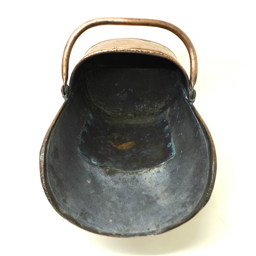 341 - A Victorian helmet shaped coal scuttle, 48cm long.