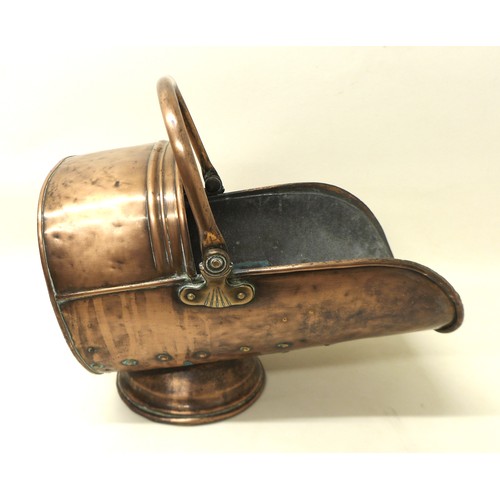 341 - A Victorian helmet shaped coal scuttle, 48cm long.