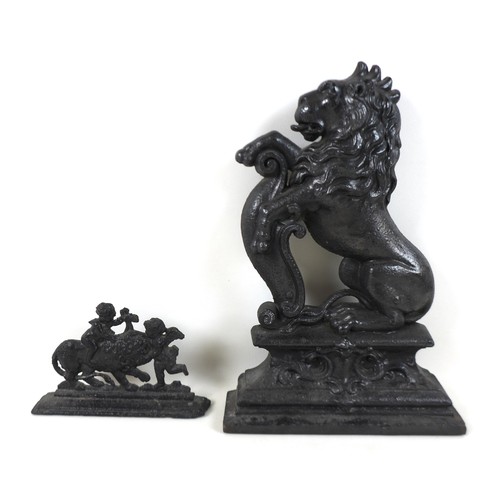 337 - A 19th century cast-iron figure of a rampant lion, 26cm by 39cm, and a smaller cast-iron group, 20cm... 