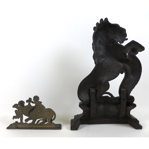 337 - A 19th century cast-iron figure of a rampant lion, 26cm by 39cm, and a smaller cast-iron group, 20cm... 