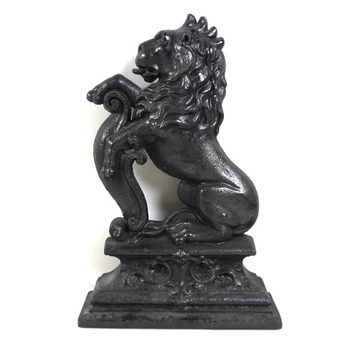 337 - A 19th century cast-iron figure of a rampant lion, 26cm by 39cm, and a smaller cast-iron group, 20cm... 