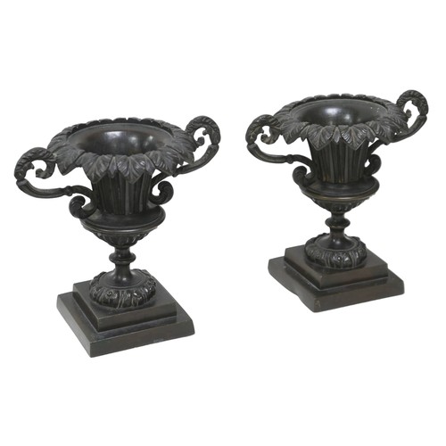 119 - A pair of 19th century neo-classical bronze urn garnitures, with weighted bases, each 15.5 by10 by 1... 