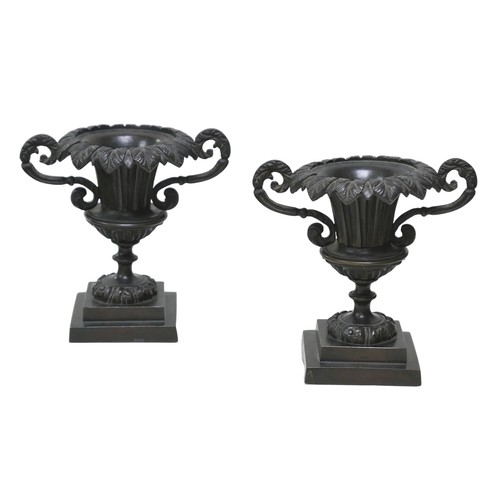 119 - A pair of 19th century neo-classical bronze urn garnitures, with weighted bases, each 15.5 by10 by 1... 