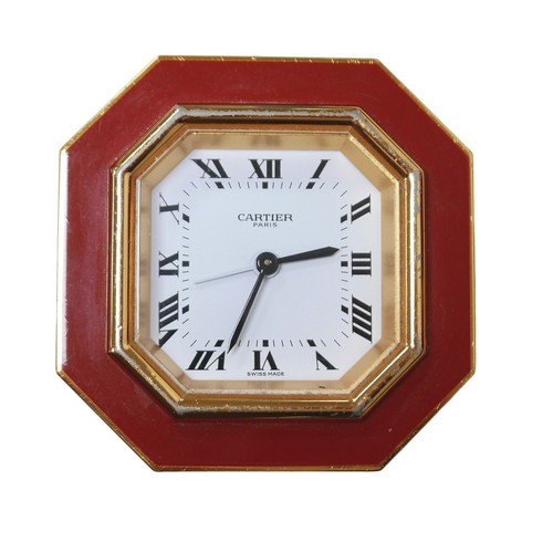 231 - A Cartier Must de travel clock, with octagonal case, with alarm, 7.5 by 7.5cm, together with its ori... 