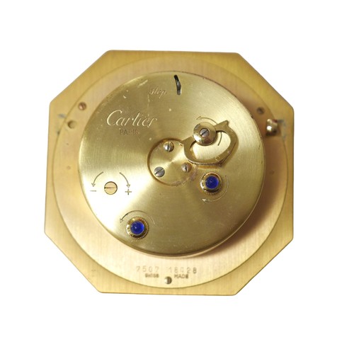 231 - A Cartier Must de travel clock, with octagonal case, with alarm, 7.5 by 7.5cm, together with its ori... 