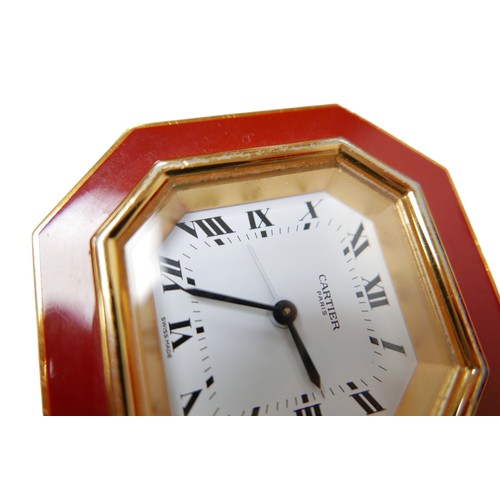 231 - A Cartier Must de travel clock, with octagonal case, with alarm, 7.5 by 7.5cm, together with its ori... 