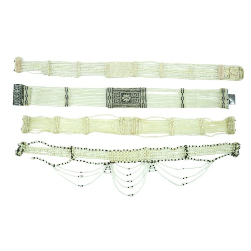 292 - Four early 20th century chokers, comprising one with a white metal clasp inlaid with marcasites, 33c... 