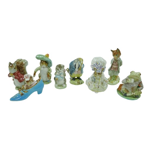 34 - Eight Beswick Beatrix Potter animal character figurines, including 'The old woman who lived in a sho... 