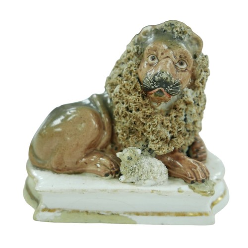 77 - A 19th century Staffordshire lion and lamb figurine, each with gilt decoration to its base, 12.5 by ... 