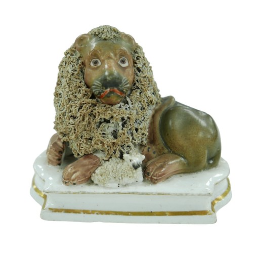 89 - A 19th century Staffordshire lion and lamb figurine, A 19th century Staffordshire lion and lamb figu... 