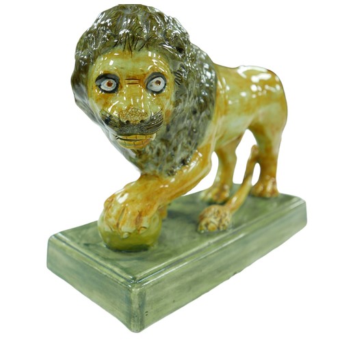 109 - An 18th century or later Staffordshire figurine modelled as a Medici lion, in naturalistic colourway... 