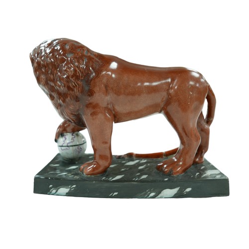 92 - A 18th century or later Staffordshire figurine modelled as a Medici lion, sangue de boeuf glazed lio... 