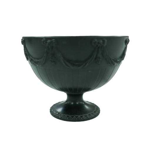 93 - A pair of 19th century Wedgwood basalt bowls, each decorated with swags above a fluted body, raised ... 