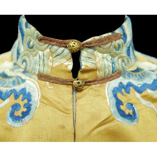 293 - An early 20th century Japanese jacket, decorated with blue chrysanthemums and butterflies on a gold ... 