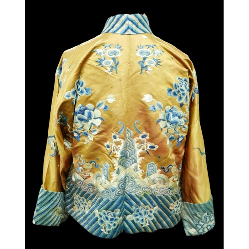 293 - An early 20th century Japanese jacket, decorated with blue chrysanthemums and butterflies on a gold ... 