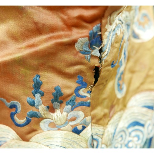 293 - An early 20th century Japanese jacket, decorated with blue chrysanthemums and butterflies on a gold ... 