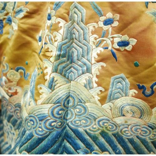 293 - An early 20th century Japanese jacket, decorated with blue chrysanthemums and butterflies on a gold ... 