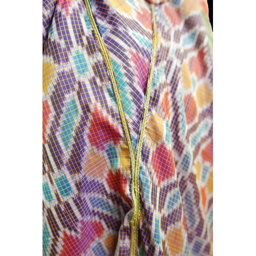 305 - A 1970s Thea Porter Couture kaftan, made of various green, pink, red and purple ground panels, adorn... 