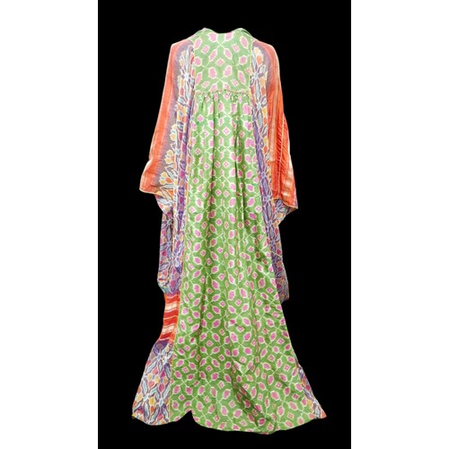 305 - A 1970s Thea Porter Couture kaftan, made of various green, pink, red and purple ground panels, adorn... 