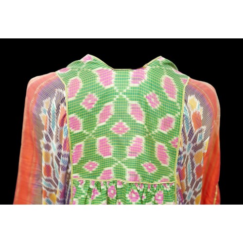 305 - A 1970s Thea Porter Couture kaftan, made of various green, pink, red and purple ground panels, adorn... 