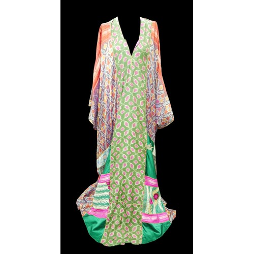 305 - A 1970s Thea Porter Couture kaftan, made of various green, pink, red and purple ground panels, adorn... 