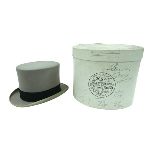 296 - Three vintage top hats, including a Henry Heath silk hat, handwritten 'S. W. Wheatley' to lining, in... 