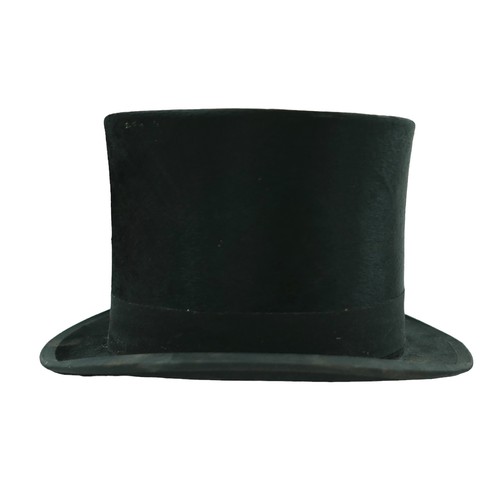 300 - Two vintage top hats, comprising  a Henry Heath hat, inner radius approximately 56cm, with fitted le... 