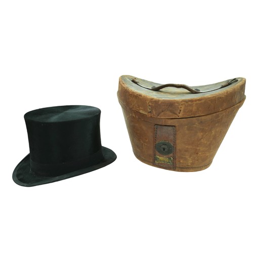 300 - Two vintage top hats, comprising  a Henry Heath hat, inner radius approximately 56cm, with fitted le... 