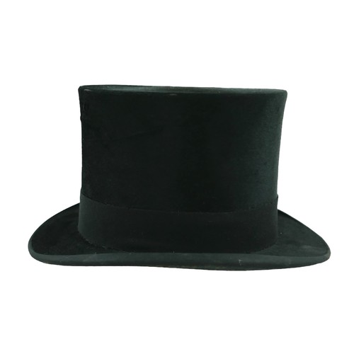 300 - Two vintage top hats, comprising  a Henry Heath hat, inner radius approximately 56cm, with fitted le... 