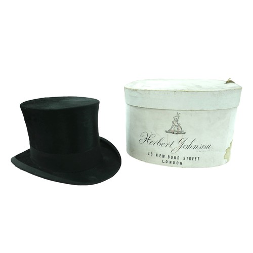 300 - Two vintage top hats, comprising  a Henry Heath hat, inner radius approximately 56cm, with fitted le... 