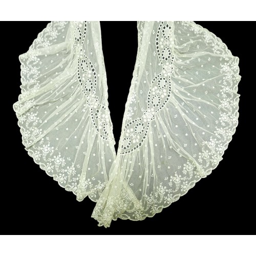 301 - An Edwardian lace gown, with ribbon ties and profuse embroidered detail.

Provenance: Privately owne... 