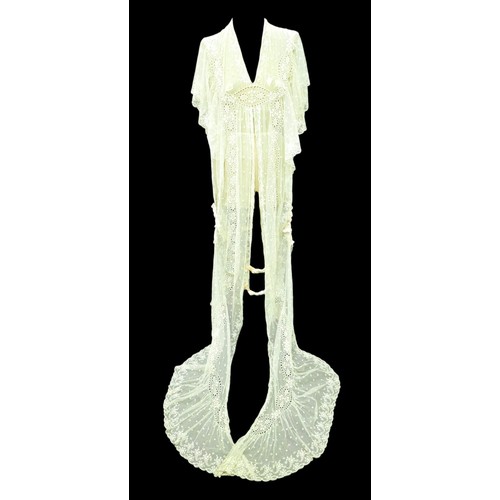 301 - An Edwardian lace gown, with ribbon ties and profuse embroidered detail.

Provenance: Privately owne... 