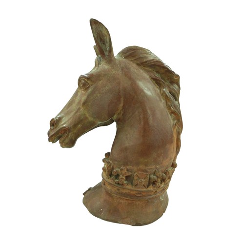 126 - A terracotta sculpture of a heraldic horse's head, with coronet around its neck, 33 by 26 by 41cm hi... 