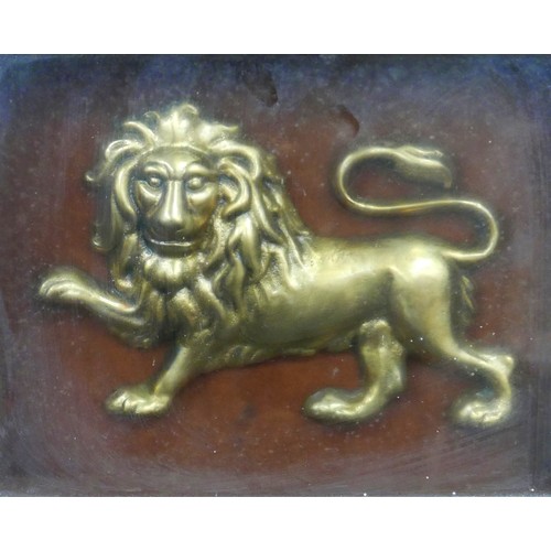 146 - A 19th century gilt metal relief plaque of a lion, lion 14 by 22cm, mounted, glazed and in a rosewoo... 