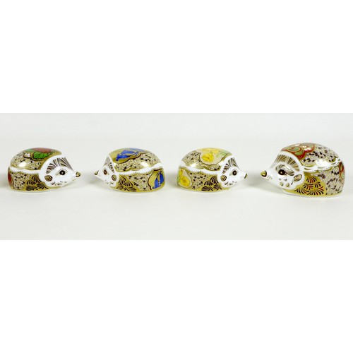 61 - A group of eight small Royal Crown Derby paperweights, all modelled as hedgehogs, comprising 'Brambl... 