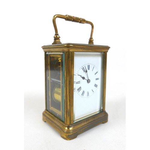 229 - A late Victorian brass carriage clock striking on a gong with leather outer case, 9 by 7 by 16cm hig... 