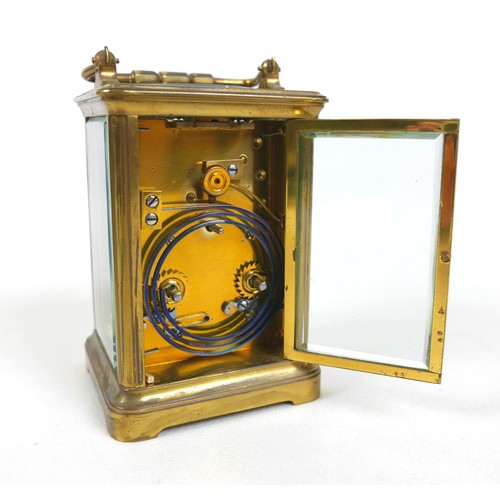 229 - A late Victorian brass carriage clock striking on a gong with leather outer case, 9 by 7 by 16cm hig... 