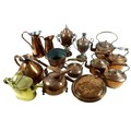 A mixed group of copper and brass items comprising of a copper electric kettle, a small copper kettl... 