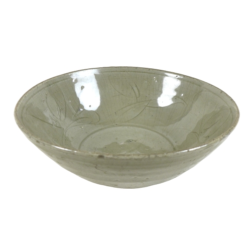 5 - A Chinese Longquan-type celadon bowl, decorated incised decoration of leaves to the inside, asymmetr... 