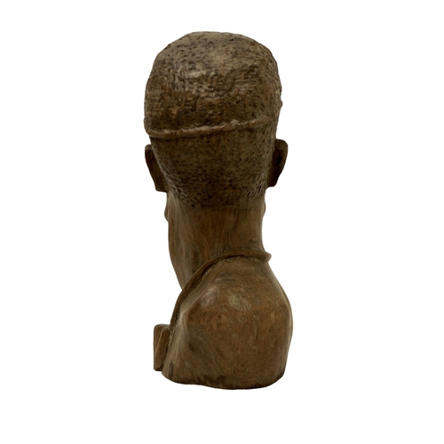 124 - An African carved bust, signed 'D. Kakweza', 23cm high.