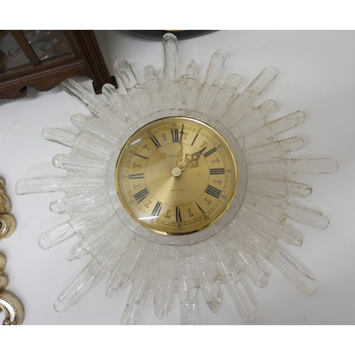 218 - A group of six clocks, comprising a Kienzle Electronic icicle effect clock with gold dial, 51 by 49c... 