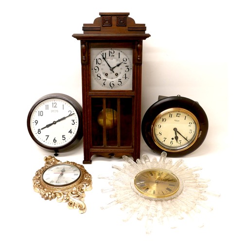 218 - A group of six clocks, comprising a Kienzle Electronic icicle effect clock with gold dial, 51 by 49c... 