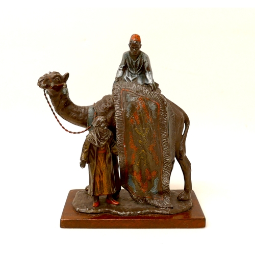 335 - A cast metal sculpture, in the style of Franz Bergmann, modelled as a Persian rug seller, with camel... 