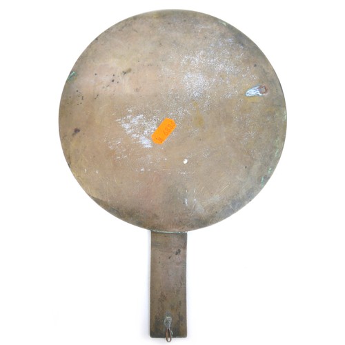 13 - A Chinese bronze hand mirror and a drug weight, mirror 20cm by 30cm, weight 20.5 grammes.