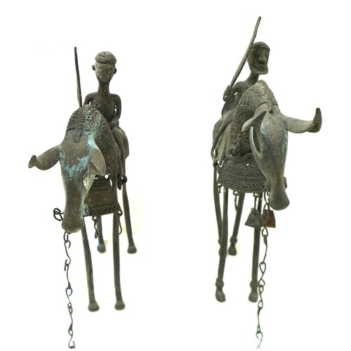 336 - A pair of bronze metal sculptures, Nigerian, mid 20th century, modelled as mounted horsemen with swo... 