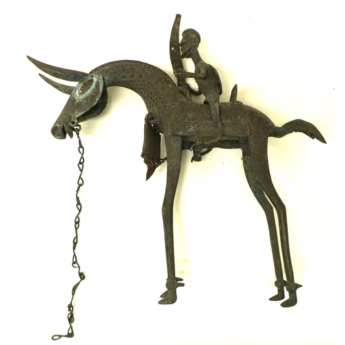 336 - A pair of bronze metal sculptures, Nigerian, mid 20th century, modelled as mounted horsemen with swo... 