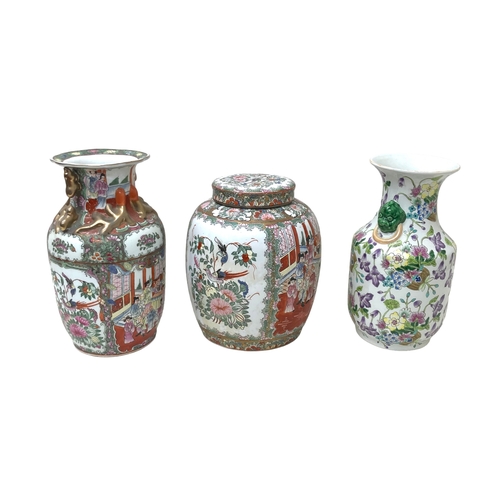 55 - A group of three modern Chinese porcelain vases, two of baluster form with twin handles, 16 by 35.5c... 