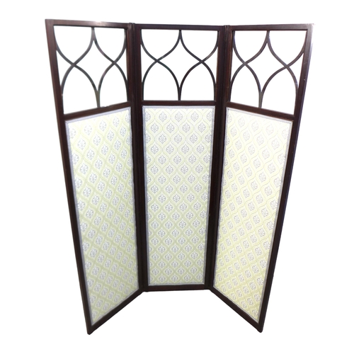 515 - An Edwardian mahogany room screen, the three panels with astragal glazed uppers and fabric panels be... 