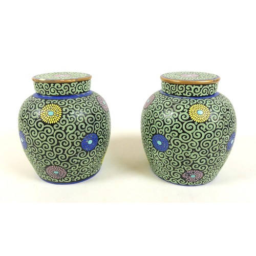21 - A pair of Chinese porcelain ginger jars and covers, mid 20th century, decorated with scrolling pale ... 